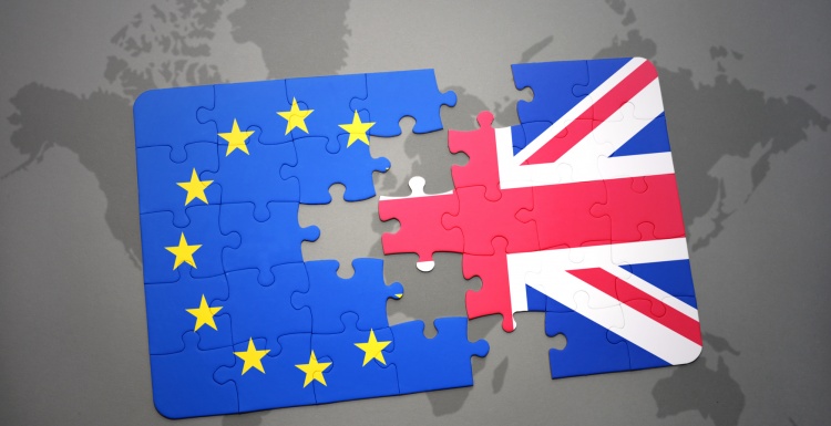 Photo: Flags of UK and EU as separate puzzle pieces; copyright:...