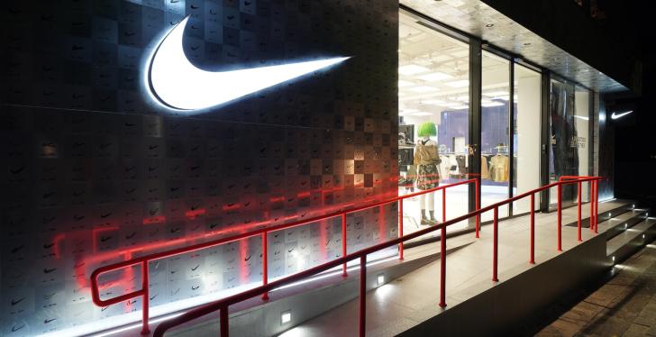 Outside view of the Nike store in Seoul with the Nike logo on the wall...