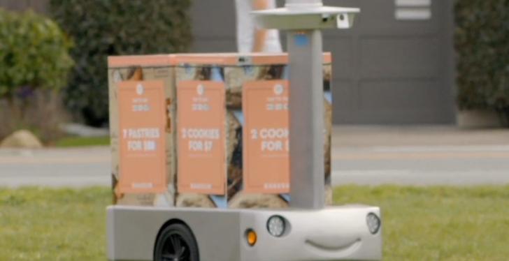 A robotic cart transporting two containers with fresh food on a lawn;...