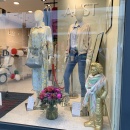 A shop window decorated with flowers to match spring....