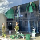 Shop windows decorated in the spring-like color green....