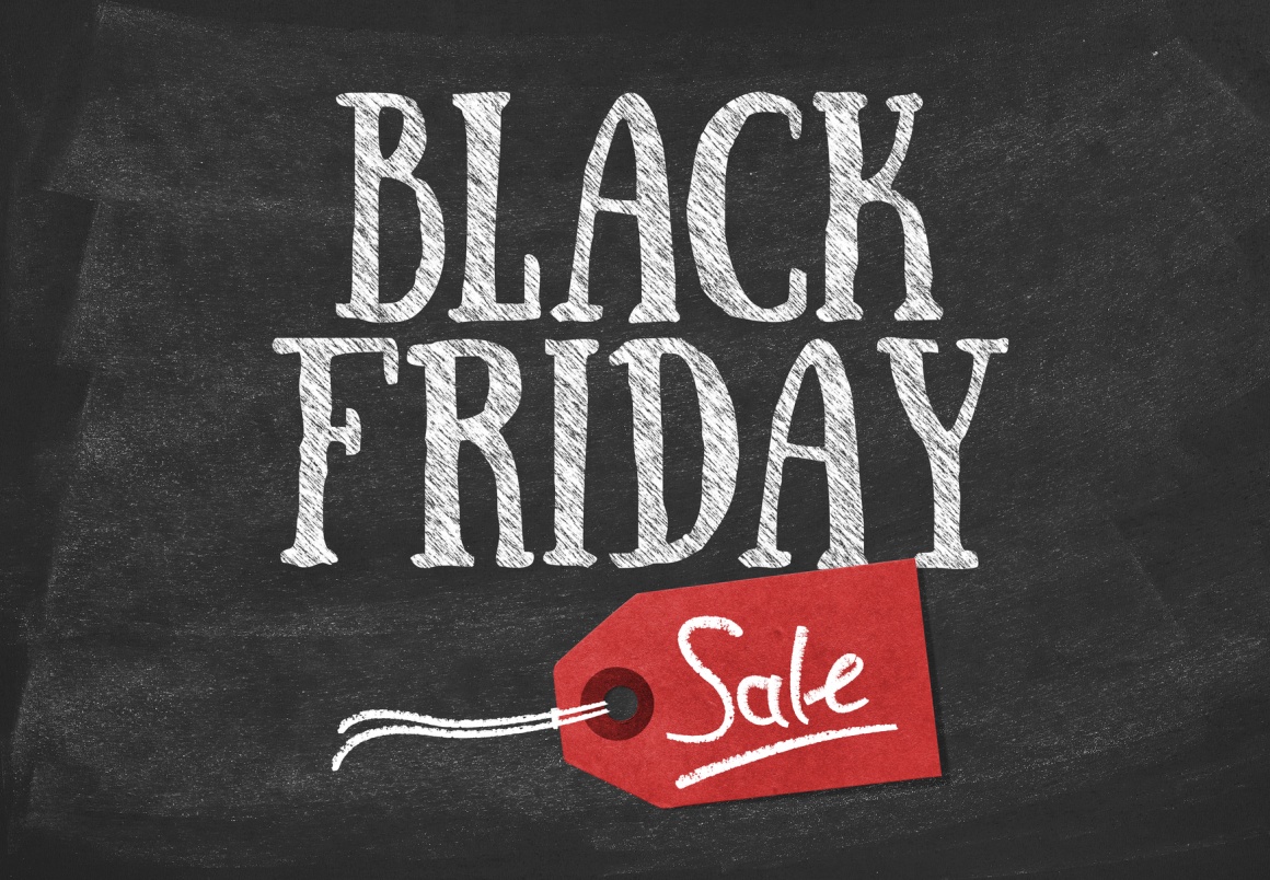Photo: White Black Friday lettering on black board with red price tag;...