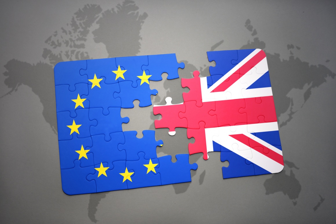 Photo: EU and UK flag made of puzzle pieces separated by gap; copyright:...