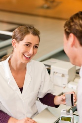 At the checkout, the pressure is twofold: enduring smile can lead to...
