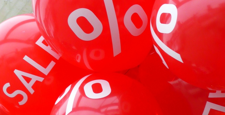 red balloons with sales text
