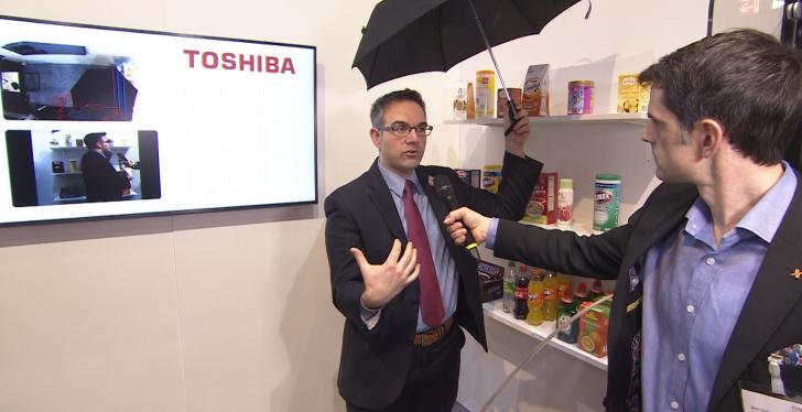 Man during Interview holding an umbrella over his head; copyright: beta-web...