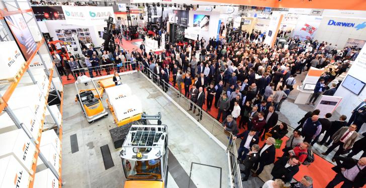 LogiMAT 2019 with visitors and one exhibitor with commercial vehicles;...