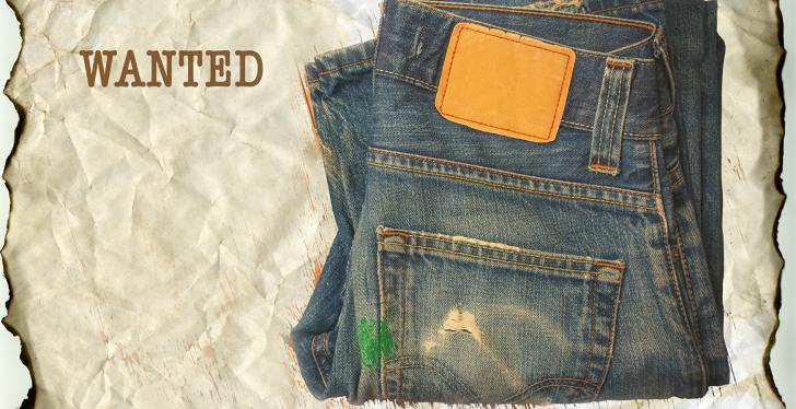 A blue jeans on a yellowed Wanted poster
