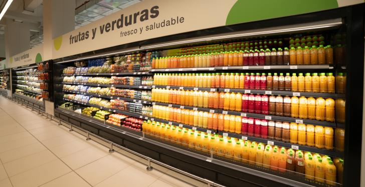 A long refrigerated shelf in the supermarket with drink bottles...
