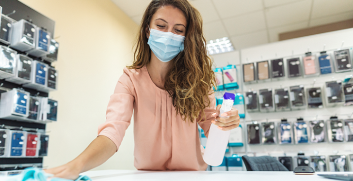 Woman disinfecting and protecting mouth and nose