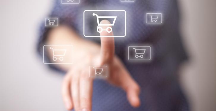 Finger touches virtual icon with shopping cart