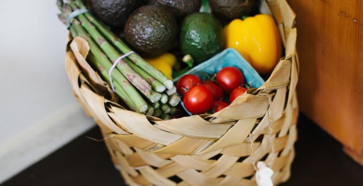A basket in a corner full of fresh foods, vegetables and fruit; copyrigth:...