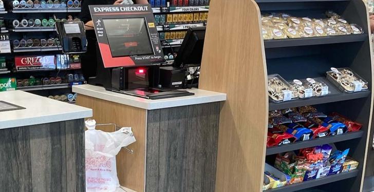 A self checkout counter in a convenience store; copyright: Pete’s of Erie Inc....