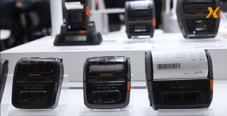 Image: Three black receipt printers in a row next to each other. Preview...