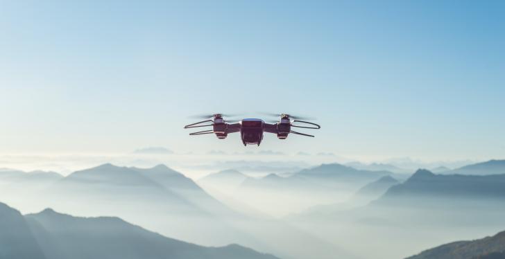 A drone flying over mountains