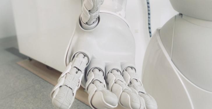 A white hand of a sophisticated robot; copyright: Possessed Photography/Unsplash...