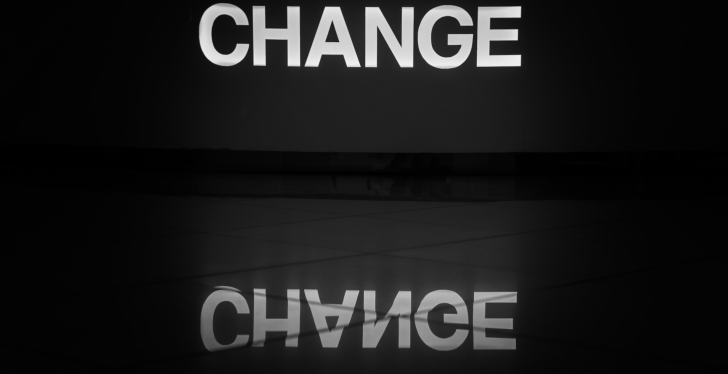 The word Change written in bright white letters on black background...