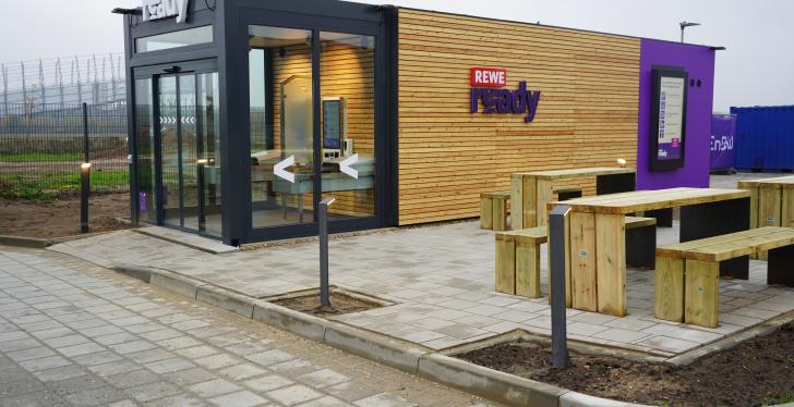 New smartstore with glass front and wooden cladding from the outside....