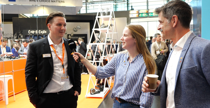 Kyra and Ben at an interview with an exhibitor at EuroShop....
