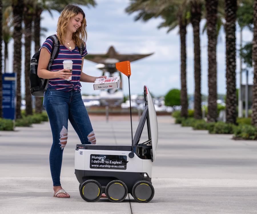 Photo: Robots say hello and deliver groceries quickly...