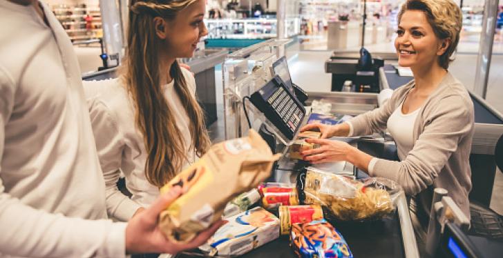 Friendly cashier serves customers