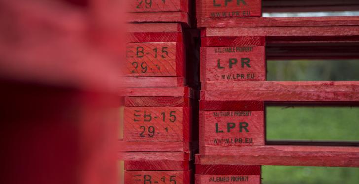 Red pallets stacked on top of each other.