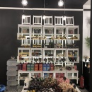 A shelf with products composed of white chairs