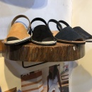 Sandals on a round wooden shelf