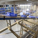 Several blue boxes on a conveyor belt