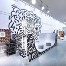 A modern design fashion pop-up store with a black and white mini half pipe as...