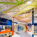 A game store with colorful shop design and rainbow-colored wooden arches as an...