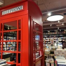 A red English telephone box is a design element in the store....