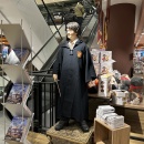 A Harry Potter figure stands in the store as a design element....