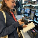 Person scans a product at the packing table with a hand scanner for final...