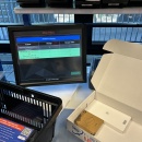 Shipping box with packed items such as playing cards and cup warmers....