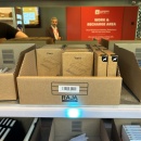 Carton of Yarra products on the shelf, blue pick-by-light illuminates to...