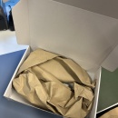 Shipping carton with protective packing paper prepared for shipping the items....