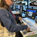 person folds up the shipping carton and closes it after packing the goods....