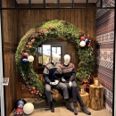 Large floral wreath combined with wood paneling.