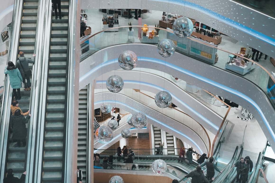 Inside view of a shopping mall with multiple levels and escalators...