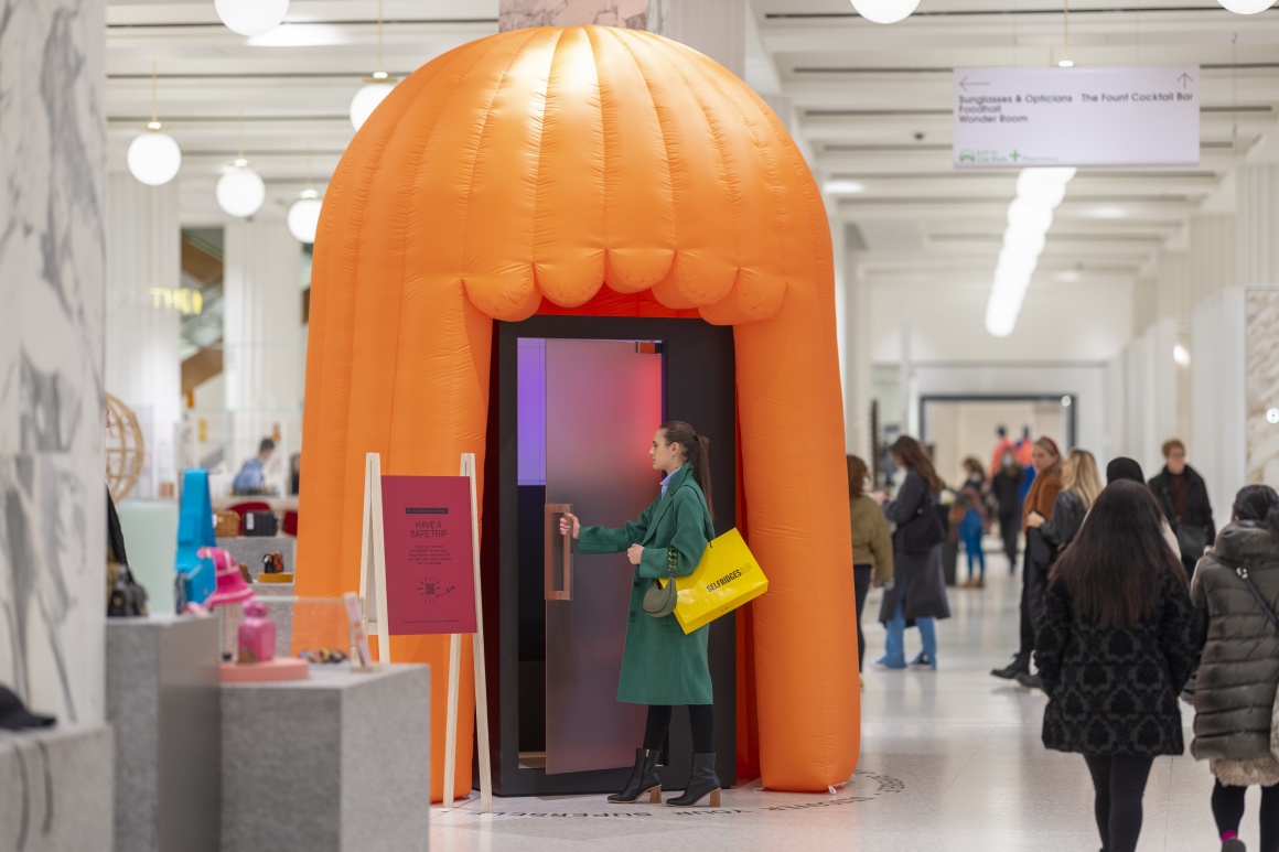 A woman walking into an orange pod; Copyright: Selfridges...