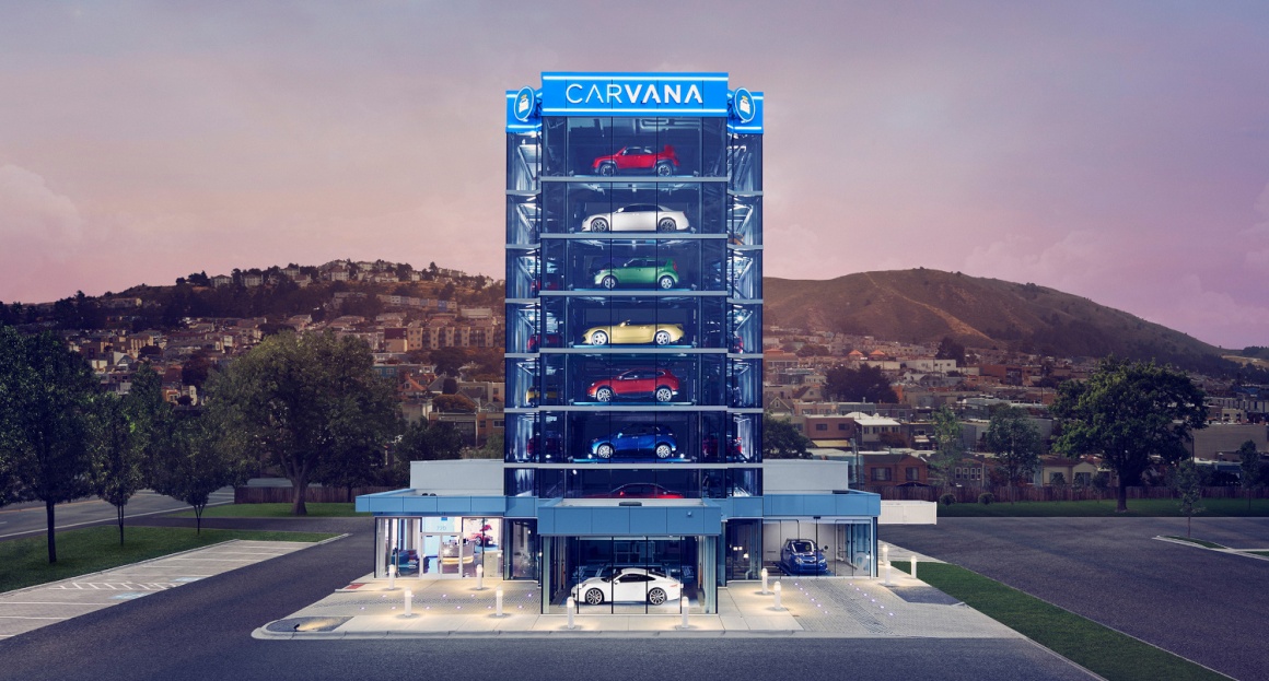 A picture of multiple cars in a car vending machine...