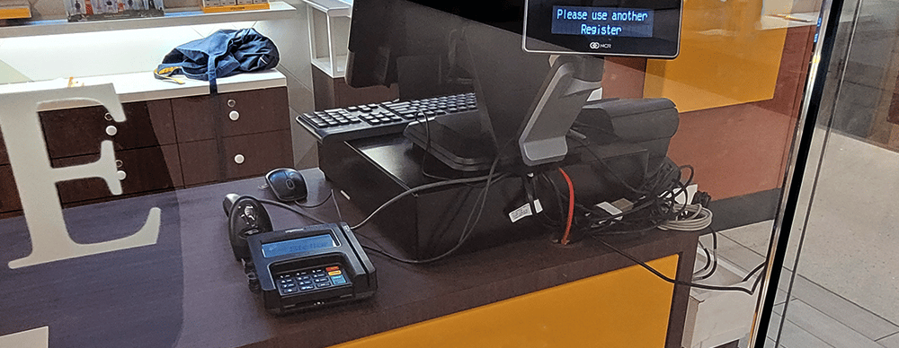 A cash desk with devices like a cash drawer, a payment device and a printer...