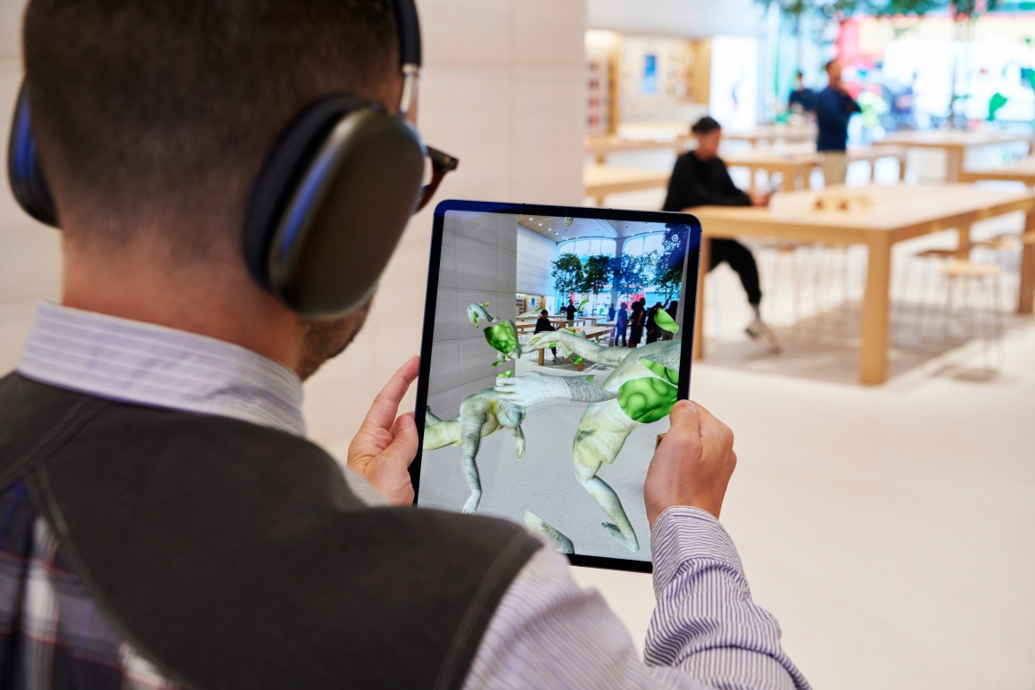 A person watches an augmented reality video on a tablet...