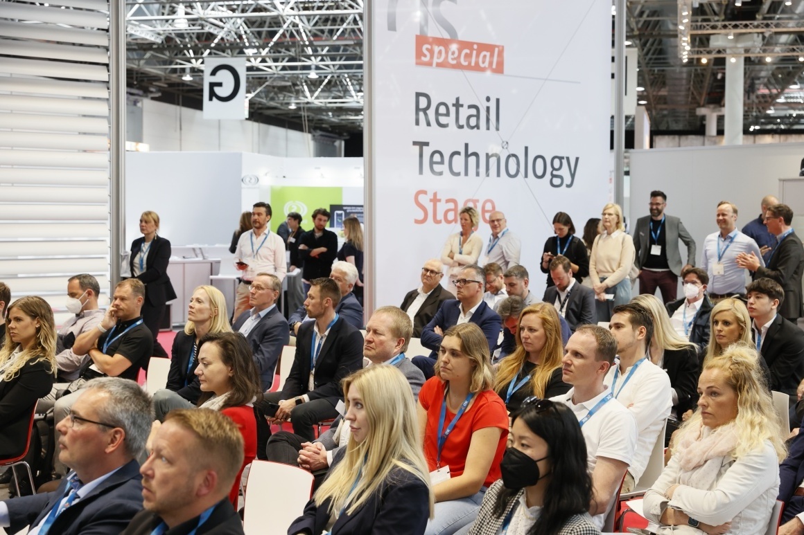 People sitting at a lecture at the EuroShop trade fair...