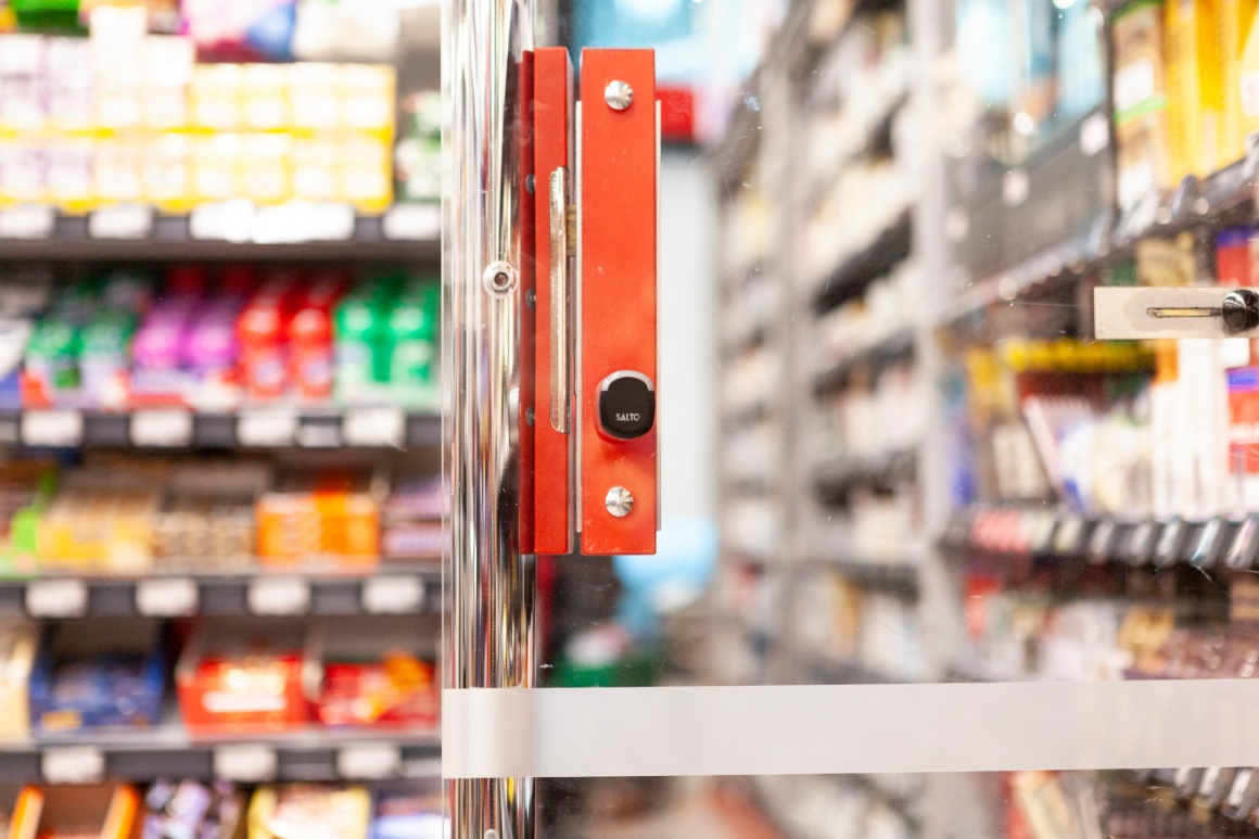 A red security cylinder on a door