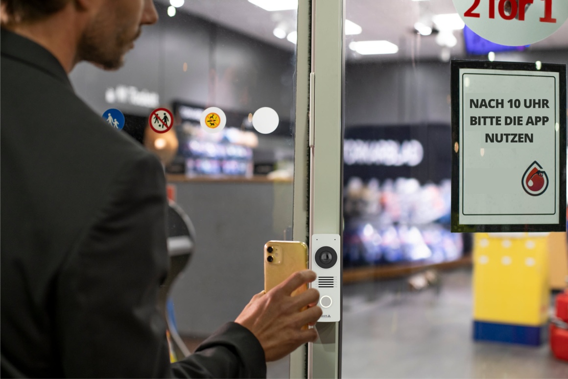 Smartphone is held in front of access control.