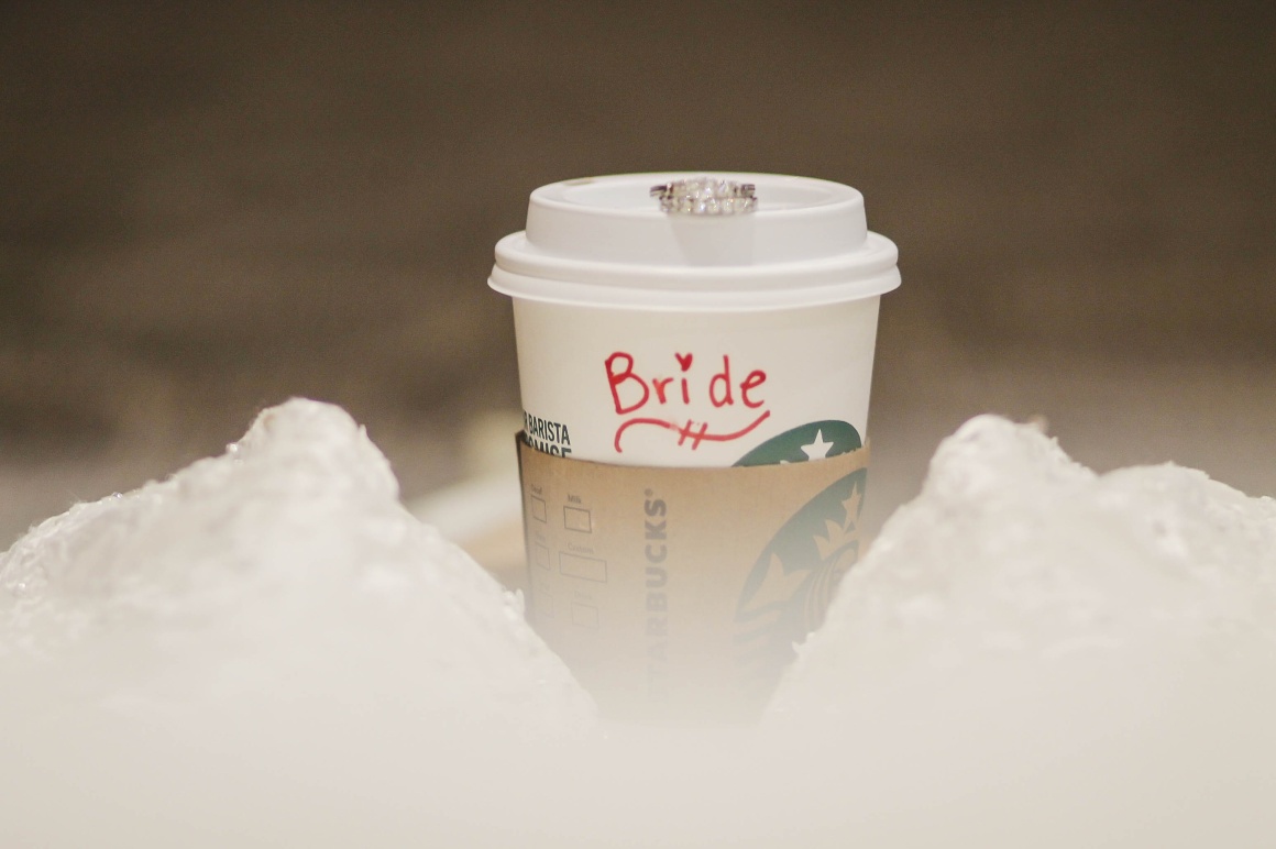 A cup from Starbucks with the inscription Bride