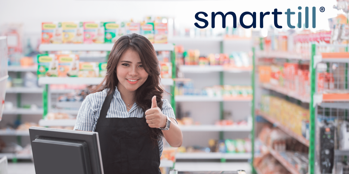 Woman with thumbs up at the checkout