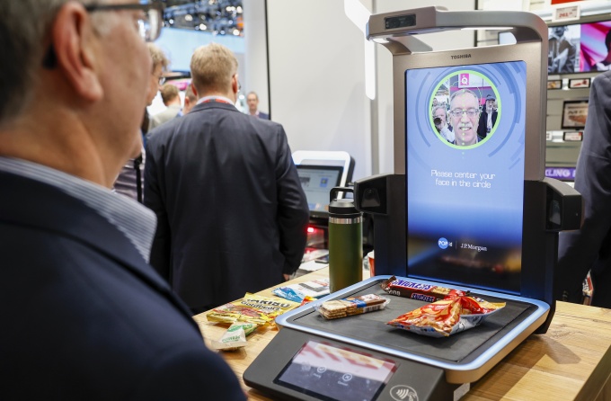 The Vision Kiosk from Toshiba is tested by one person....